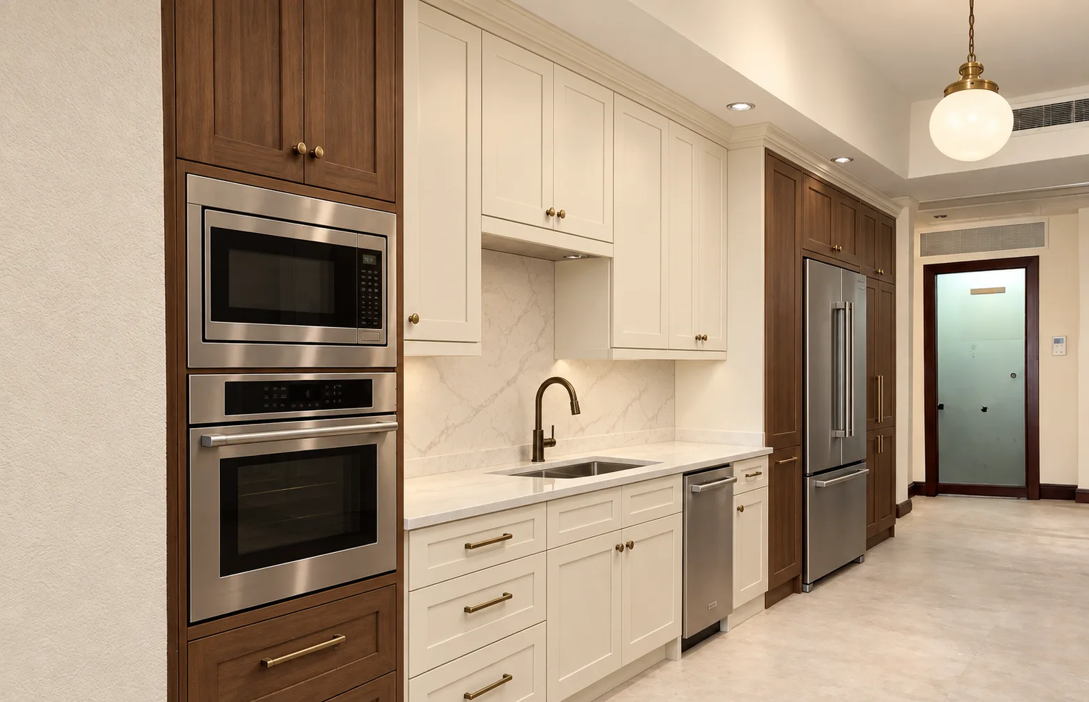 A finished two-tone Shaker kitchen with walnut towers and cream cabinets